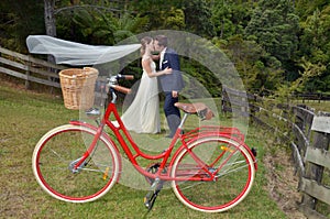 Husband and wife kiss on their wedding Day outdoors