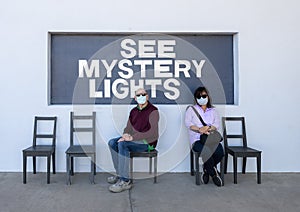 Husband and wife at a photography spot in Marfa, Texas referring to the famous Marfa mystery lights.