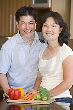 Husband And Wife Preparing Meal