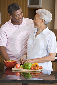 Husband And Wife Preparing Meal