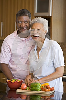 Husband And Wife Preparing Meal