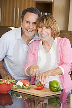 Husband And Wife Preparing Meal