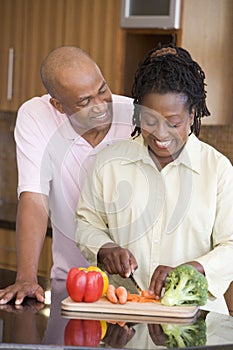 Husband And Wife Preparing A Meal Together