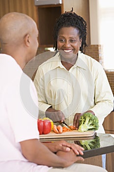 Husband And Wife Preparing A Meal Together