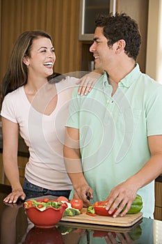 Husband And Wife Preparing A Meal Together