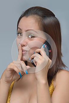 Hushing girl with cellphone