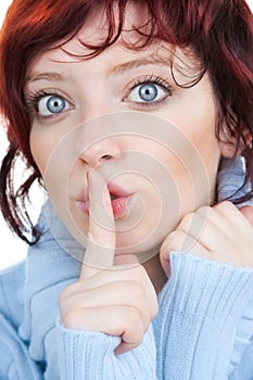 Hushing woman closeup photo