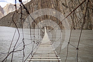 Hussaini Suspension Bridge Over Hunza River In Gojal Valley Of Hunza, Pakistan.