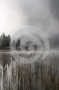 Hut in autumn-fog