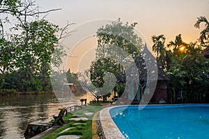 The hut beside of canel and pool in the countryside