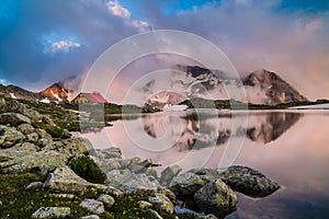 Hut in high mountain with lake