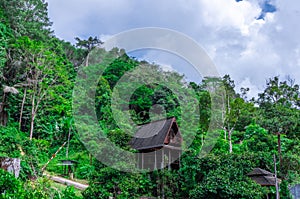 Hut at Kathu waterfall water gently flowing down the rocks Patong Phuket Thailand Asia