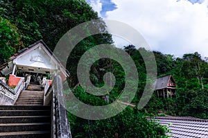 Hut at Kathu waterfall water gently flowing down the rocks Patong Phuket Thailand Asia