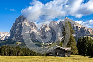 Hut on Seiser Alm in front of Langkofel and Plattkofel, South Tyrol
