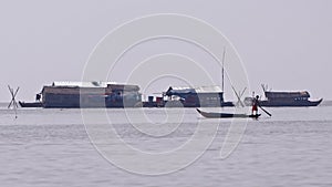 Huts and fishermen at Tonle Sap, Cambodia