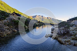 Huts and stream in mountains