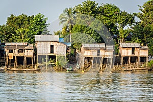 Huts on the riverbank at Burmese fishing village