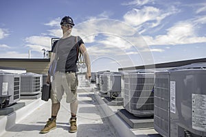 Hvac Tech bewtween Condensers