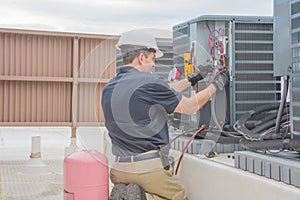 HVAC Tech Checking Condenser