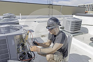 Hvac Tech holding a volt meter