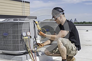 Hvac tech looking at a  multimeter