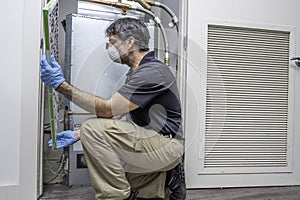HVAC Technician Inspecting Air Filter