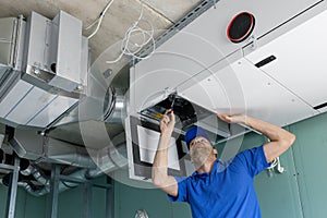 Hvac technician install ducted heat recovery ventilation system with recuperation