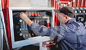 HVAC technician servicing home heating and cooling system