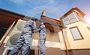 HVAC technicians servicing home heating and cooling system