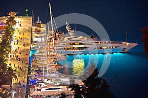 Hvar bay and yachting harbor aerial panoramic evening view