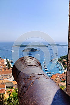 Hvar town from the Spanish Fortress with an old canon in the for