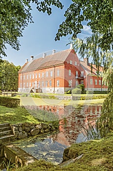 Hviderup Slott through the trees