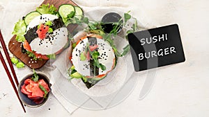 Hybrid modern food. Sushi burger with salmon, white rice, avocado, cucumber