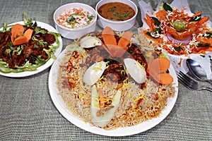 Hyderabadi cuisine Chicken biryani boneless, raita, shorba, salad,  natukodi vepudu