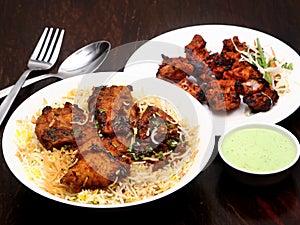 Hyderabadi cuisine Fish biryani, North Indian chicken tikka