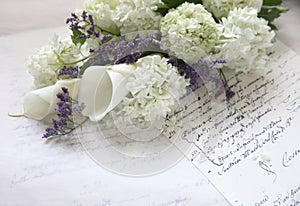 Hydrangea flower bouquet on old script