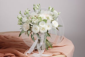 Hydrangea rich bouquet. Vintage floristic background, colorful roses, antique scissors and a rope on an old wooden table