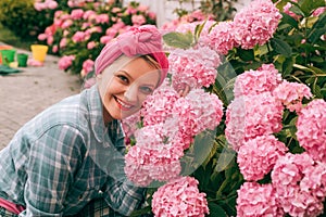 Hydrangea. Spring and summer. Flower care and watering. soils and fertilizers. Greenhouse flowers. woman care of flowers