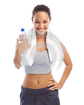 Hydrating after an invigorating workout. A beautiful young woman in sportswear holding a bottle of water.