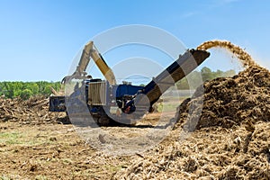 A hydraulic crane loading for shredding machine in roots wood