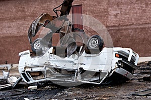 Hydraulic crushing machine crushing a vehicle photo