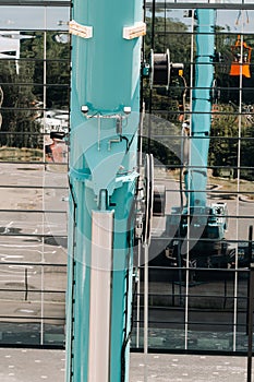 Hydraulic cylinder of the lifting system on a car crane.The control system of the crane engine.Lifting the hydraulic compartment