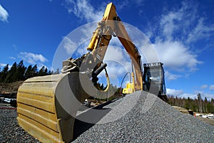 Hydraulic excavator against blue sky