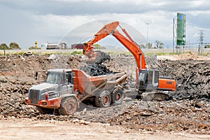 Hydraulic Excavator, Articulated Dump Truck Landfill Clearing