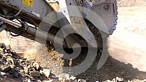 Hydraulic excavator loads blasted rock to BelAZ.