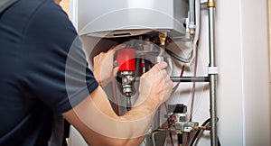 Hydraulic mechanic installer repairs an electric water heater