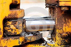 Hydraulic metal pipe and yellow dirty metal