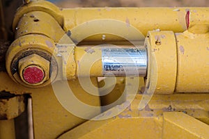 Hydraulic metal pipe and yellow dirty metal
