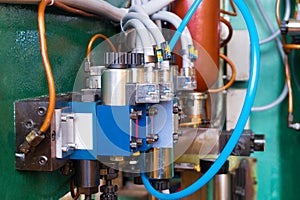 Hydraulic system of the machine, oil under pressure in hydraulic pipes, repair of industrial equipment control systems