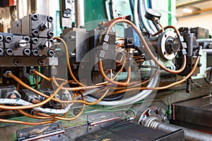 Hydraulic system of the machine, oil under pressure in hydraulic pipes, repair of industrial equipment control systems